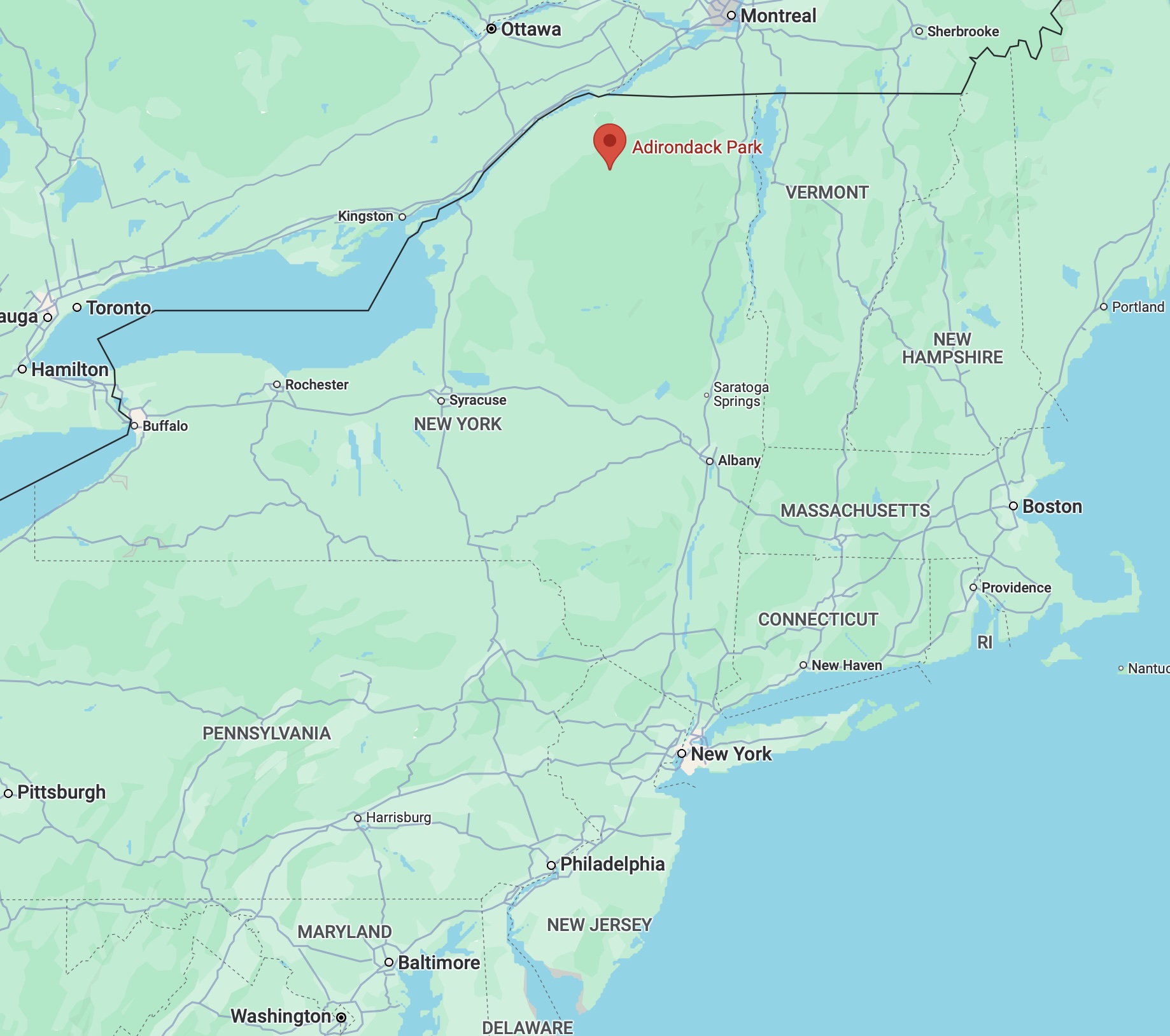 Map of New York State, with red pin in location of Adirondack State Park.