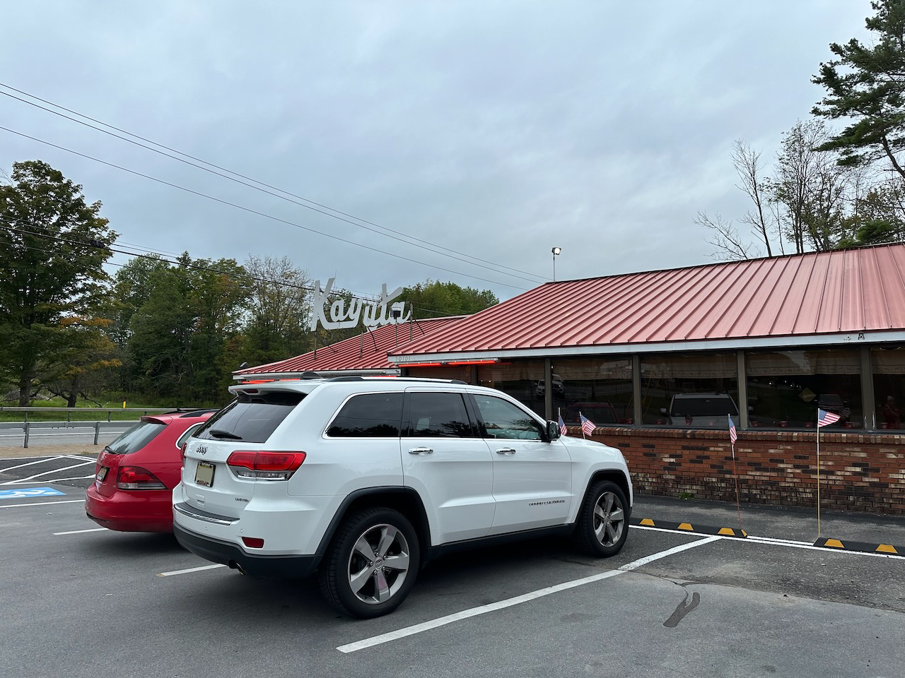 2014 Jeep Grand Cherokee parked in front of Kayuta Ice Cream restaurant.