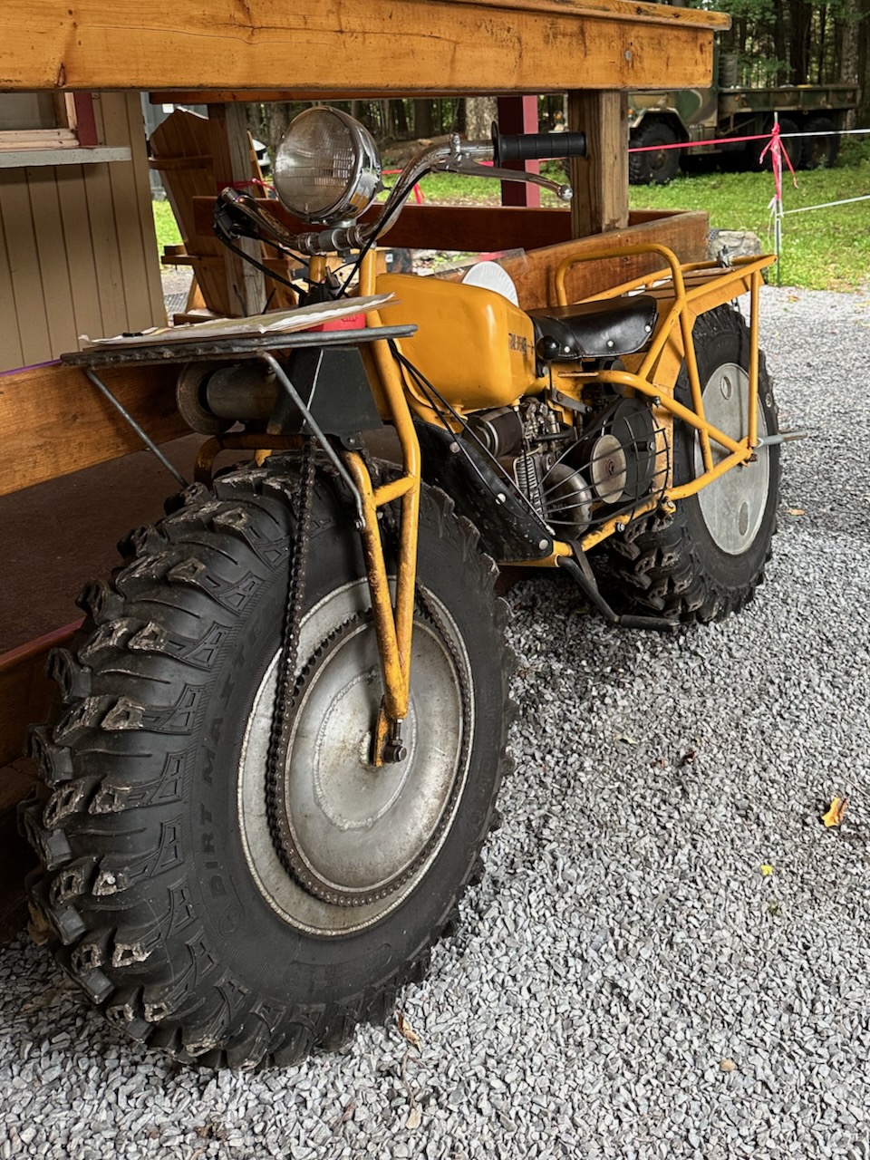 Rokon Trailbreaker motorcycle beside donut shop.