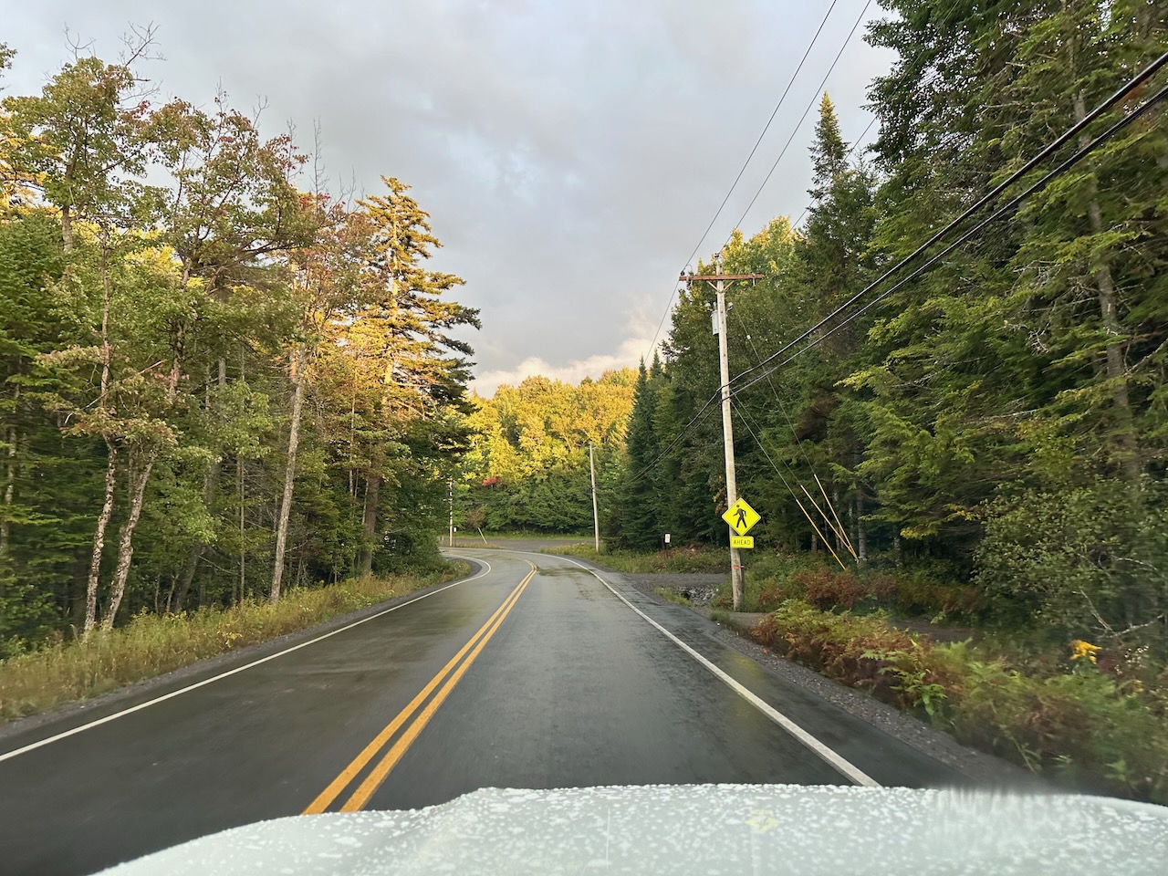 View of Big Moose Road with storm clouds in sky.