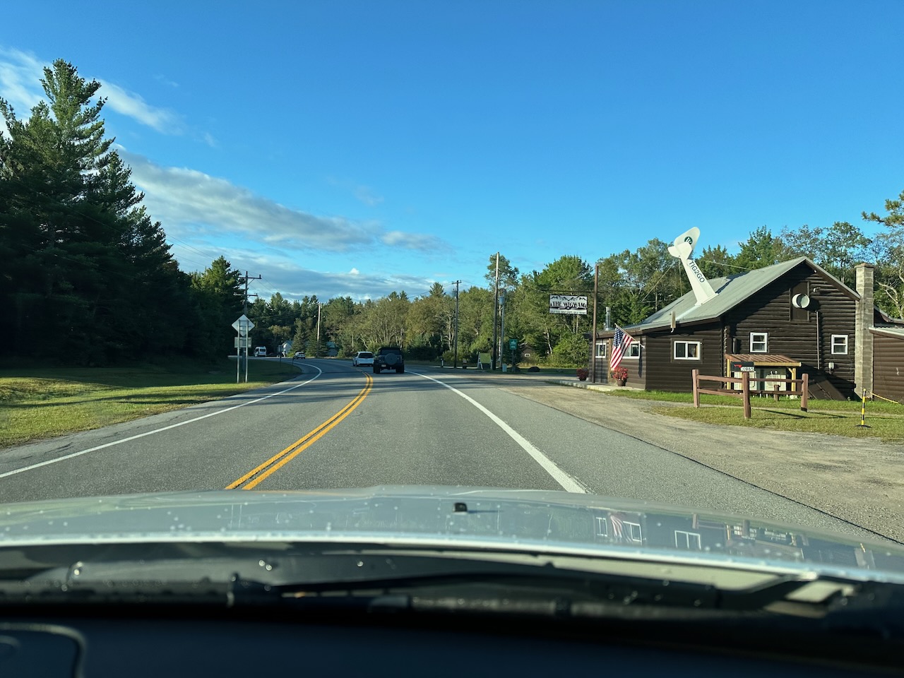 View of Wigwam Tavern on NY-28, under blue skies.