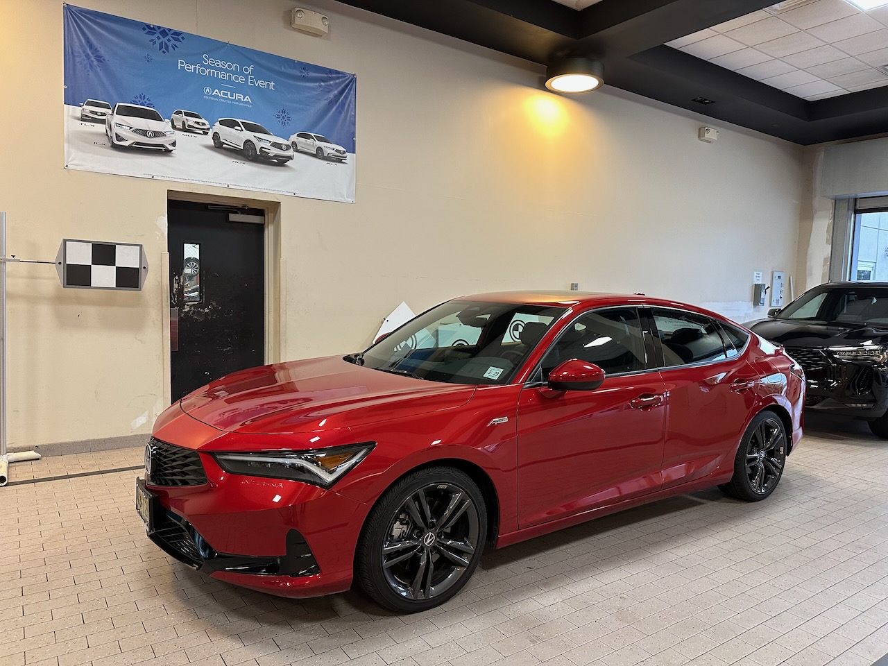 2025 red Acura Integra in service drive.