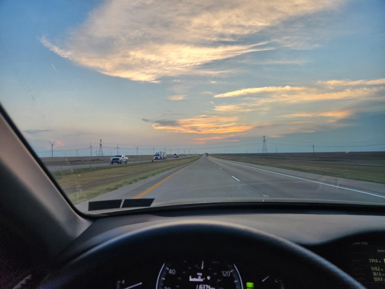 View of highway at dusk through windshield of 2014 Honda Accord.
