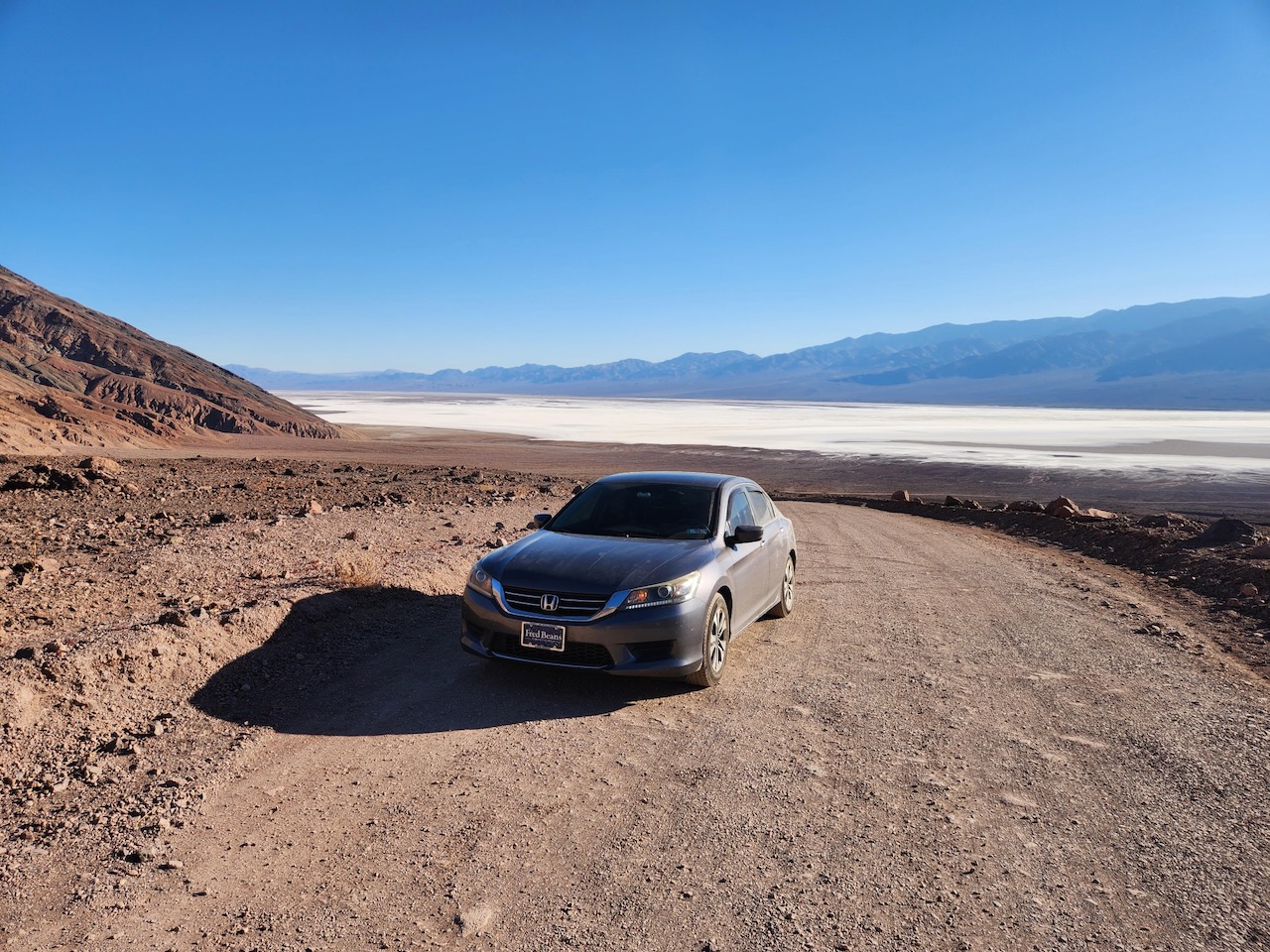 2014 Honda Accord parked in dirt parking lot at Death Valley.