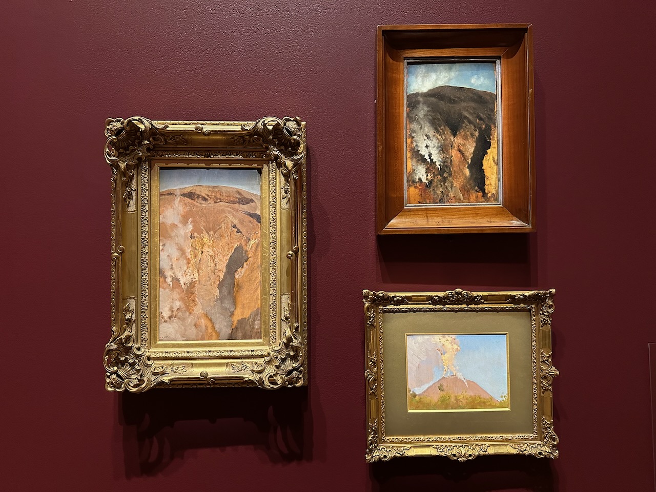 Three paintings by painter Giuseppe de Nittis on gallery wall.