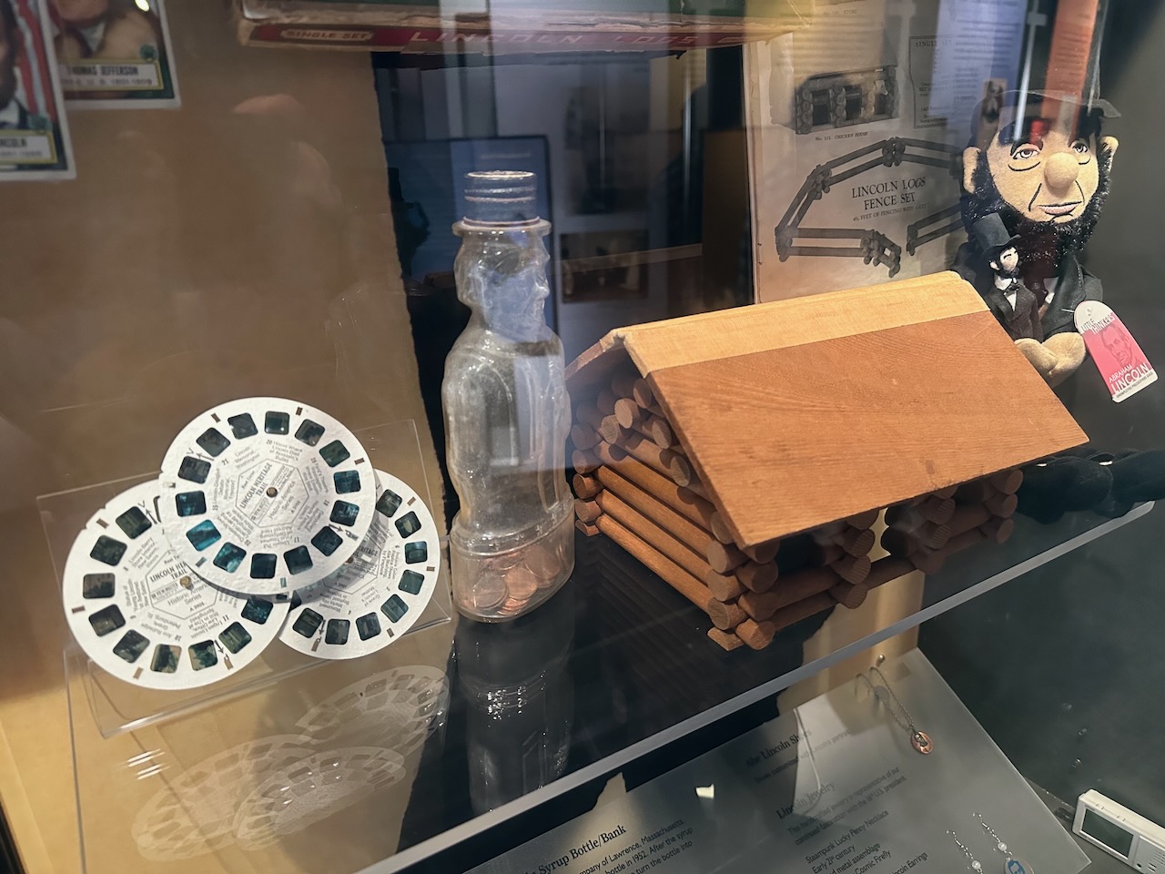 Display of toys and dolls featuring Abraham Lincoln's likeness.