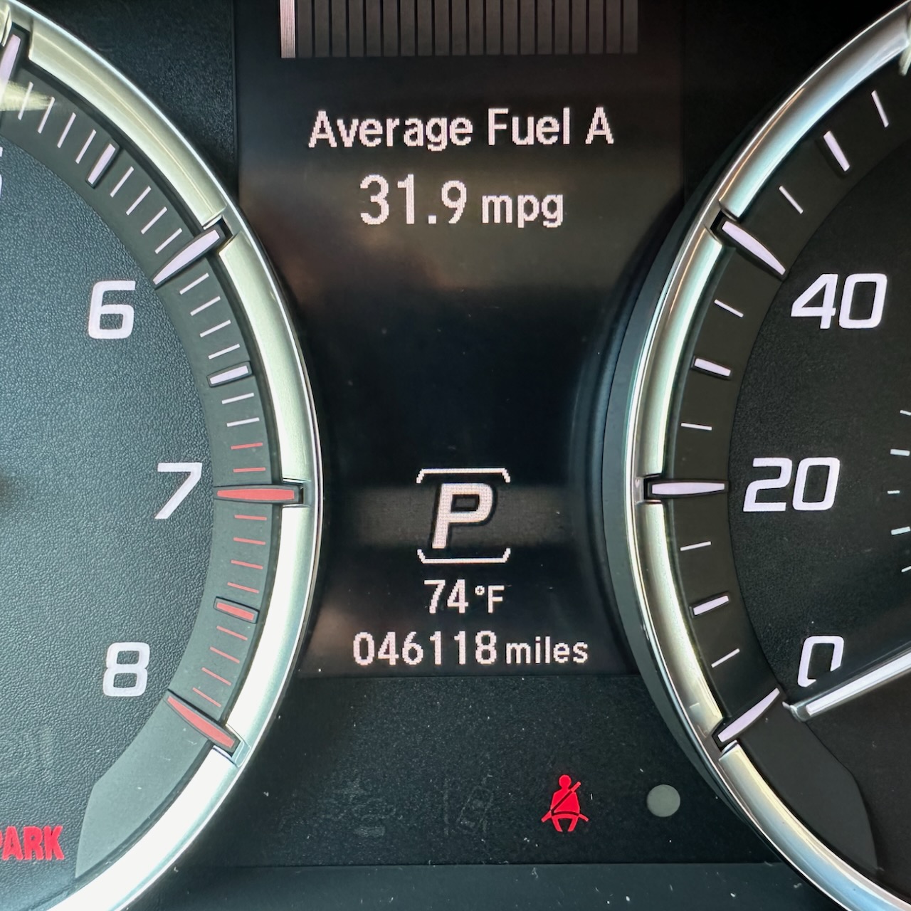 Car odometer reading 46118 miles.