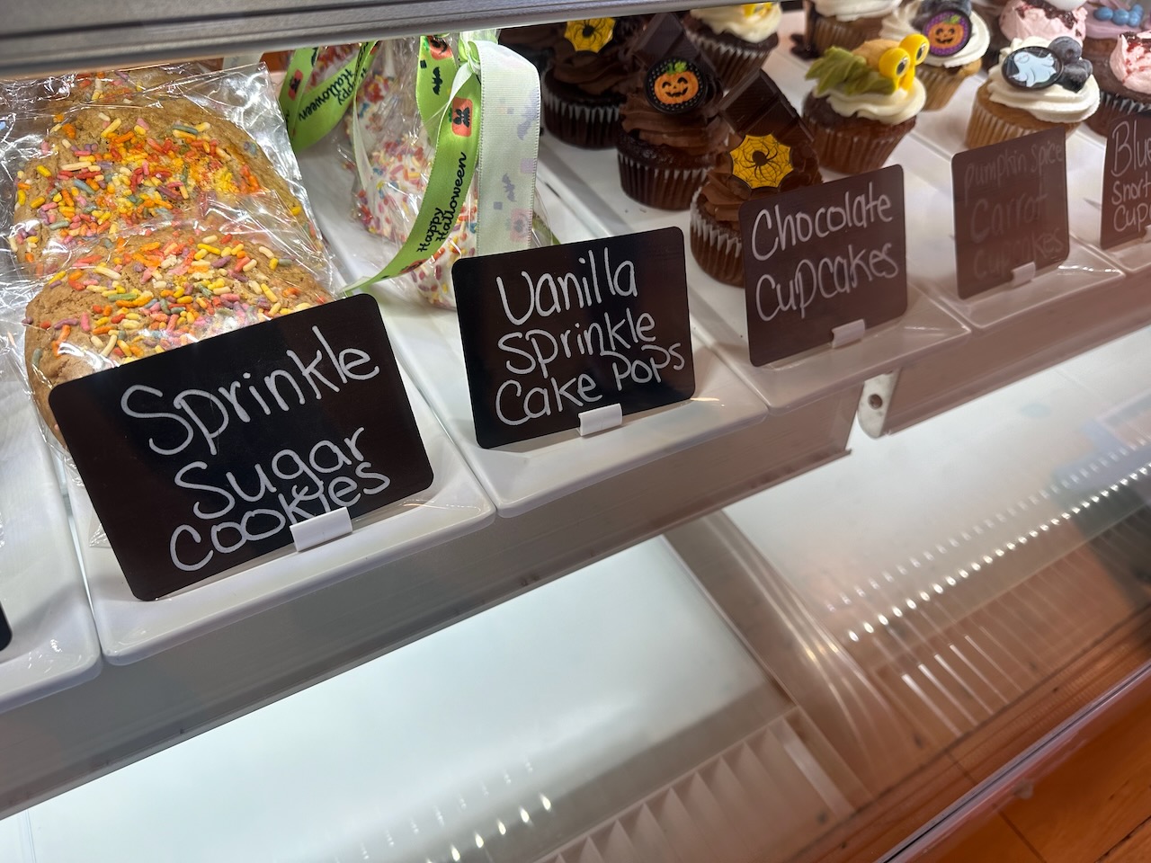 Baked goods on display in cooler.