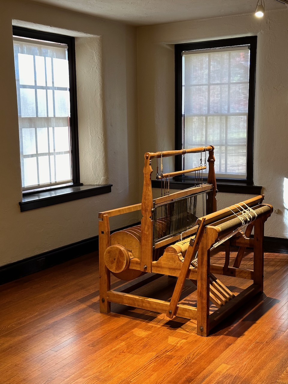 Loom in center of room.