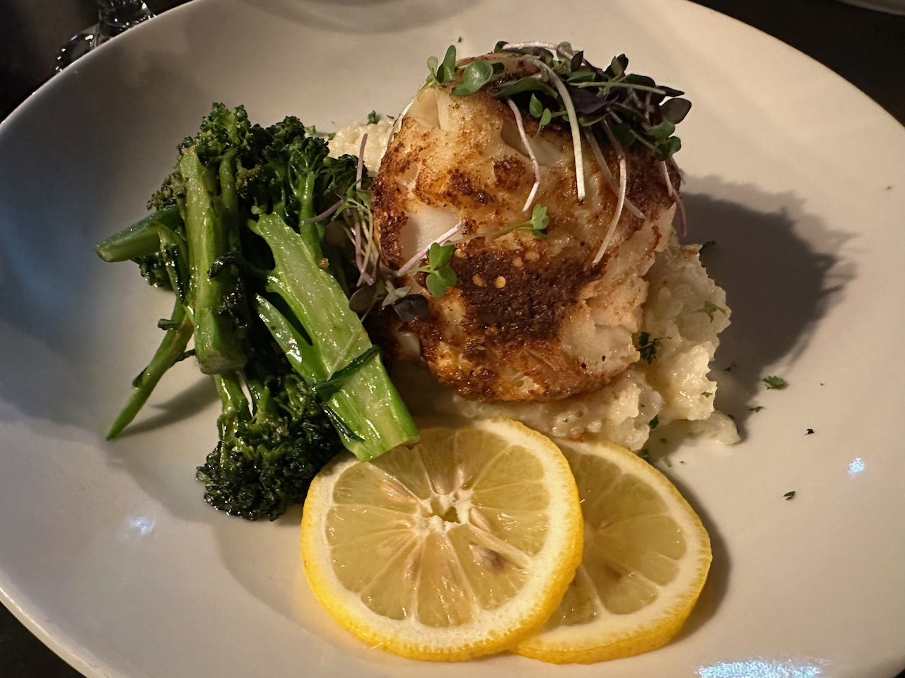 Stuffed haddock with risotto and broccolini.