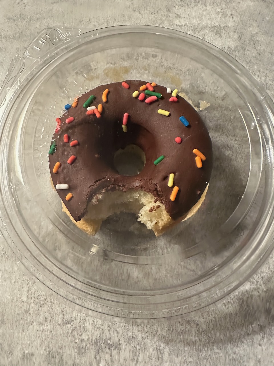Donut with bite taken out of it.