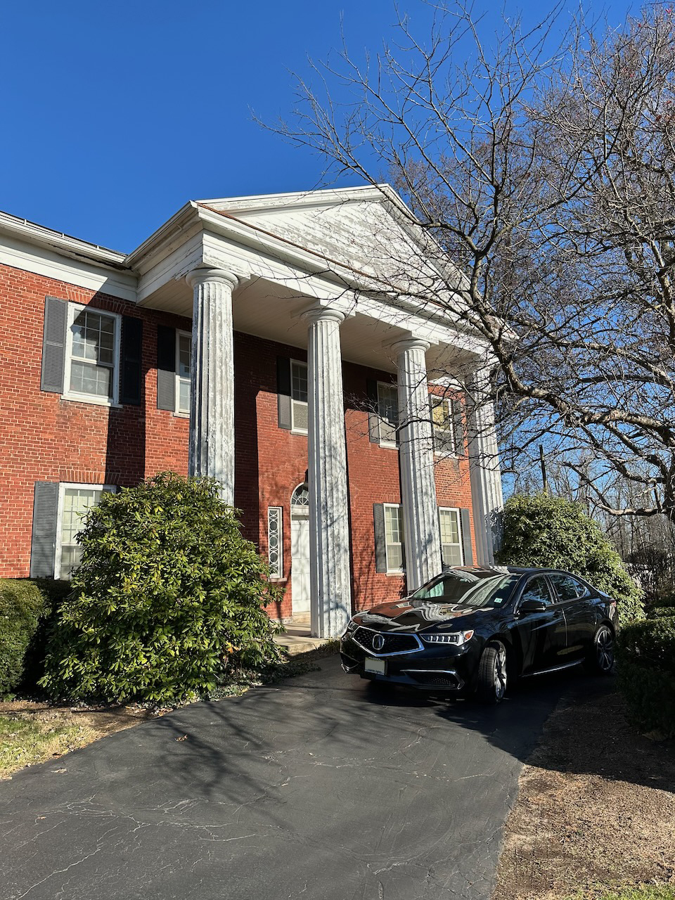 2020 Acura TLX parked in front of Hunt House.