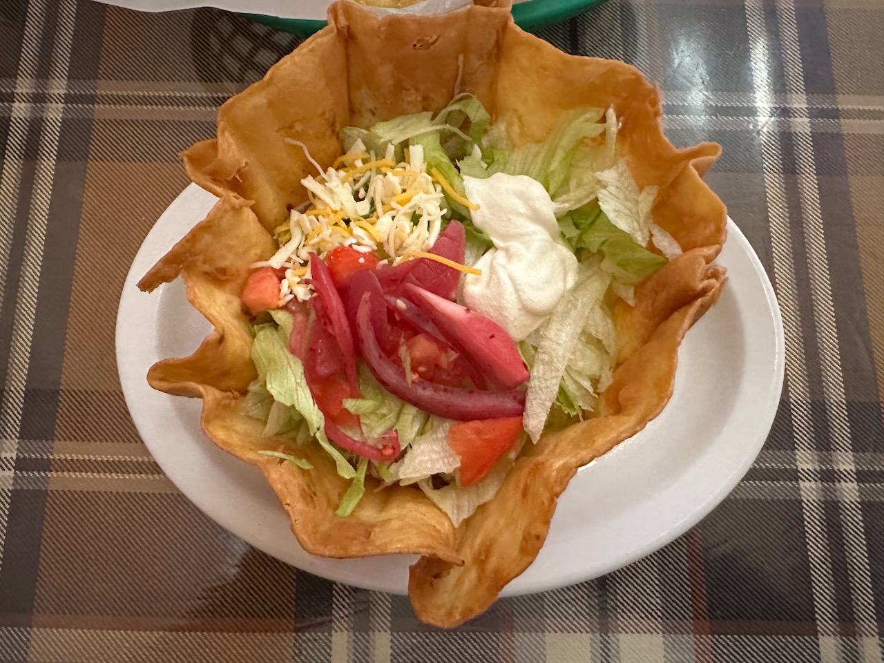 Taco salad on white plate.