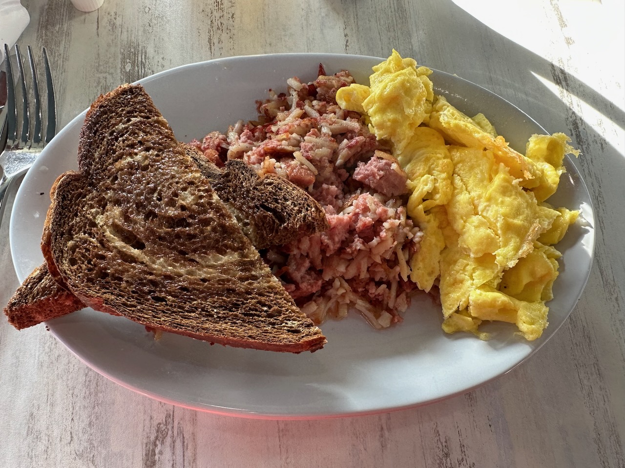 Toast, eggs, and corned beef hash.