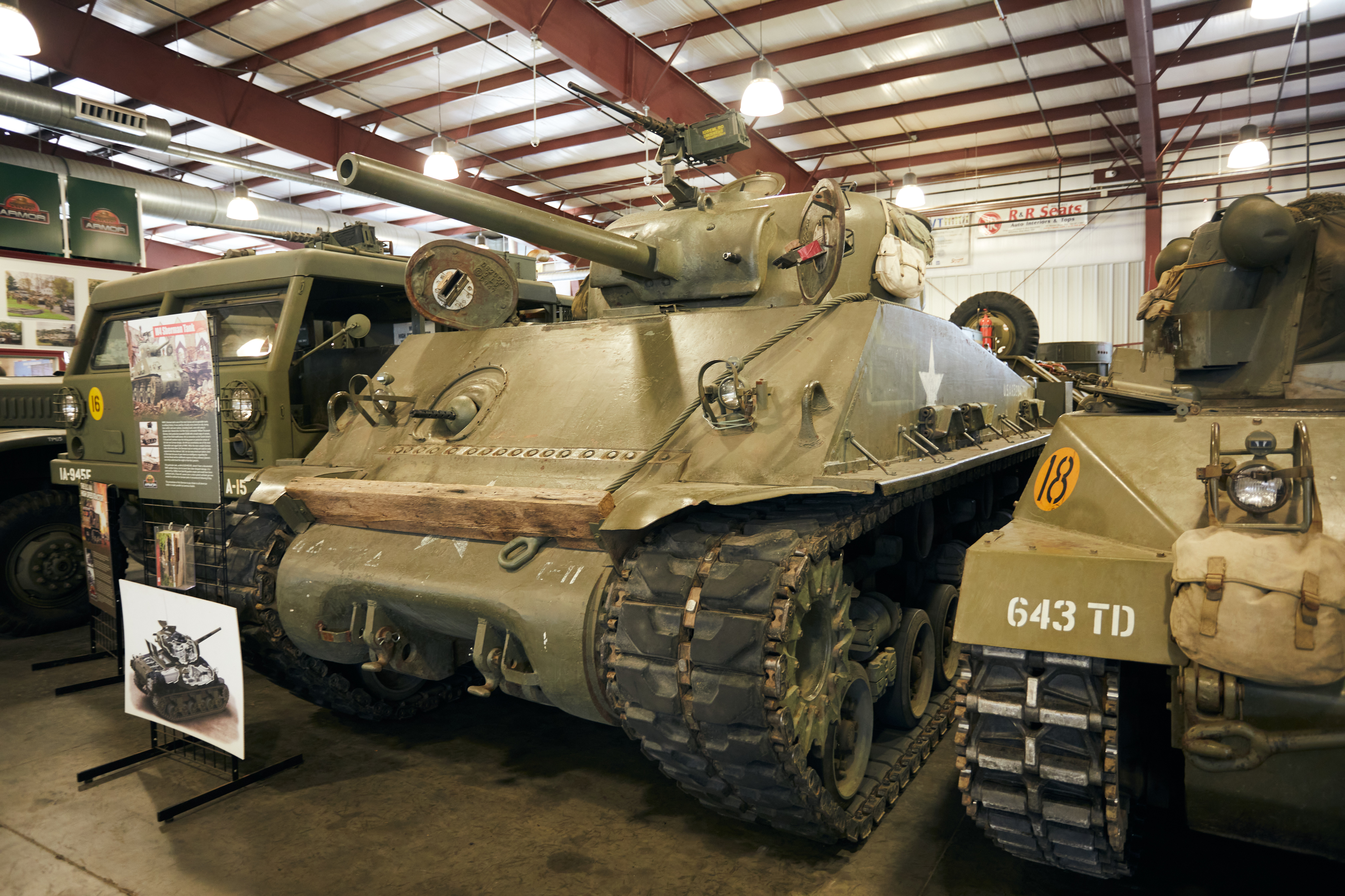 M4 Sherman tank in row of other vehicles.