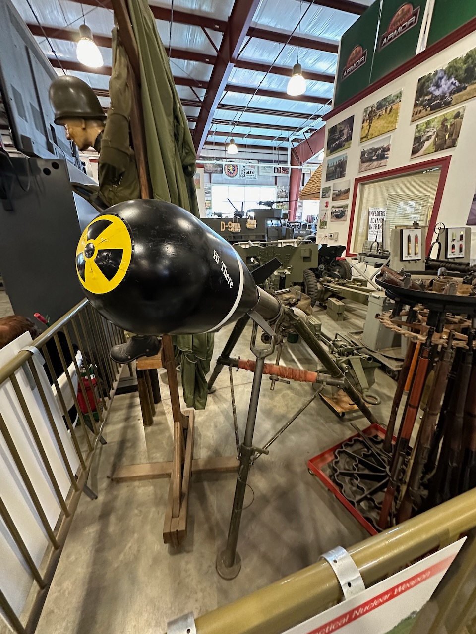 Nuclear tipped rocket amid display of other military equipment.