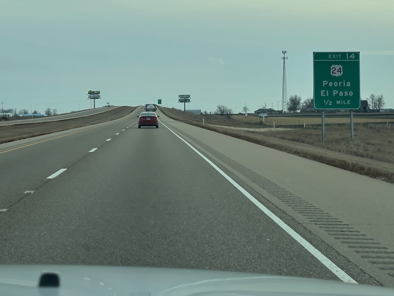 Interstate 39, with sign along right side of highway for Exit 14 - 24 Peoria El Paso 1/2 mile.