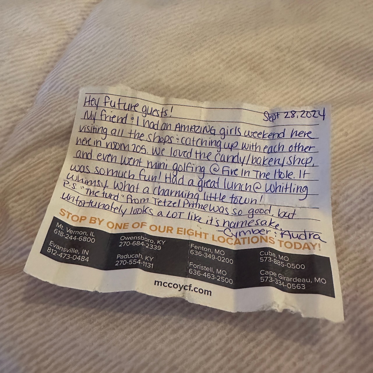 Handwritten note to future room guests from Cymber and Amanda, two guests who had stayed in room previously.