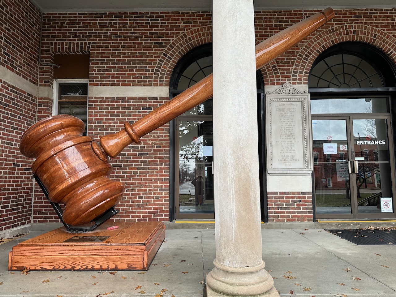 Large gavel outside entrance to courthouse.