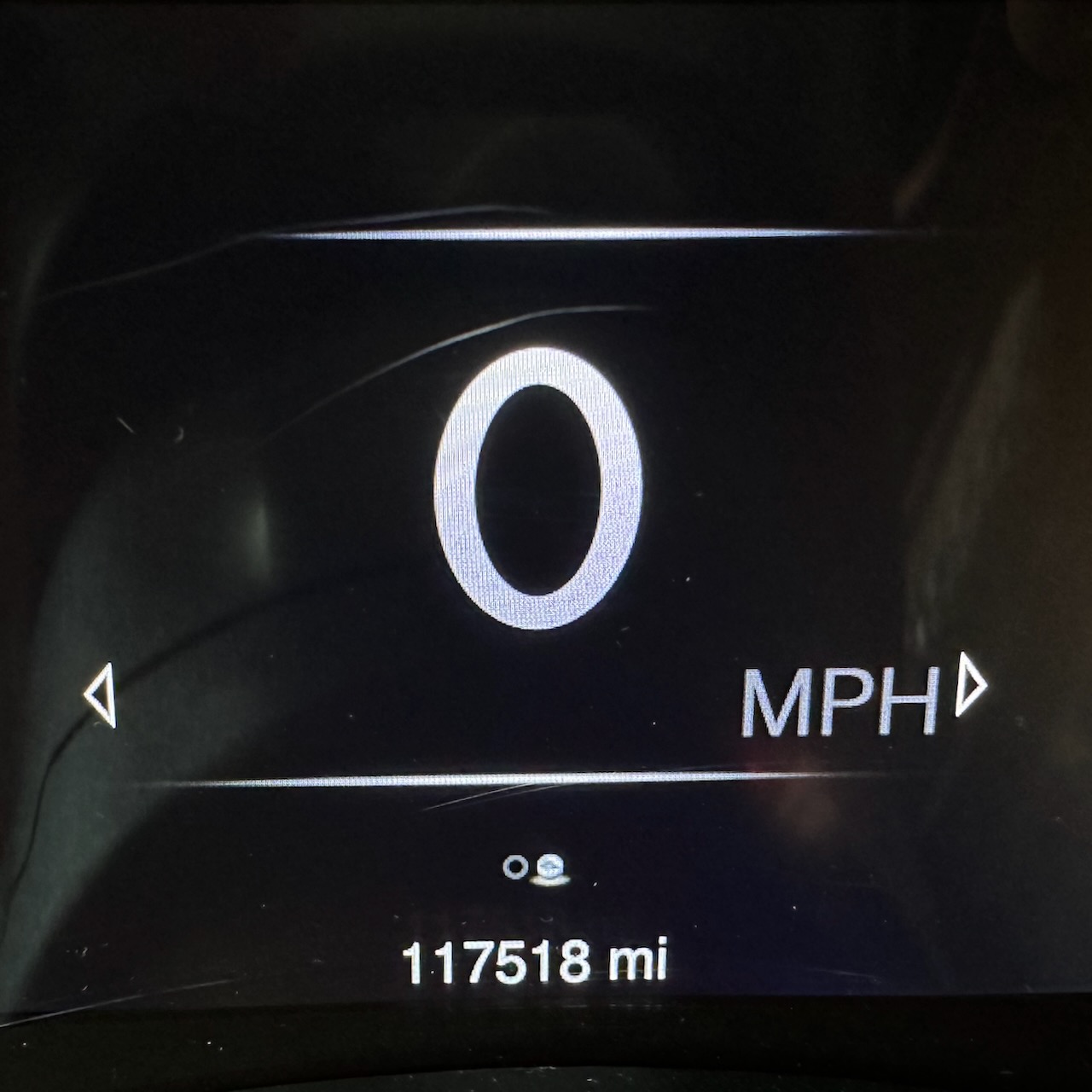 Car odometer reading 117518 miles.