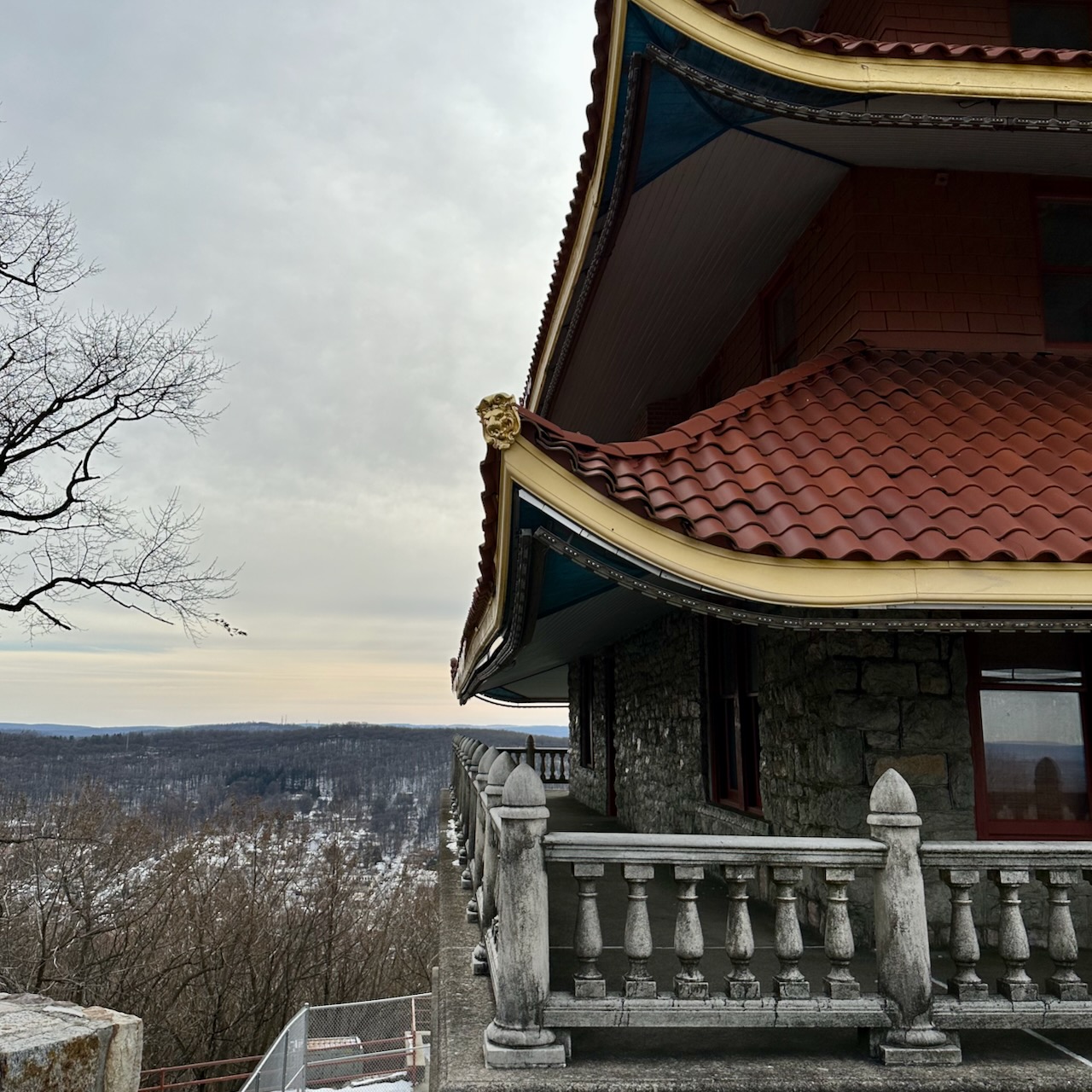 Close up of angled roofs of two tiers of the pagoda. 