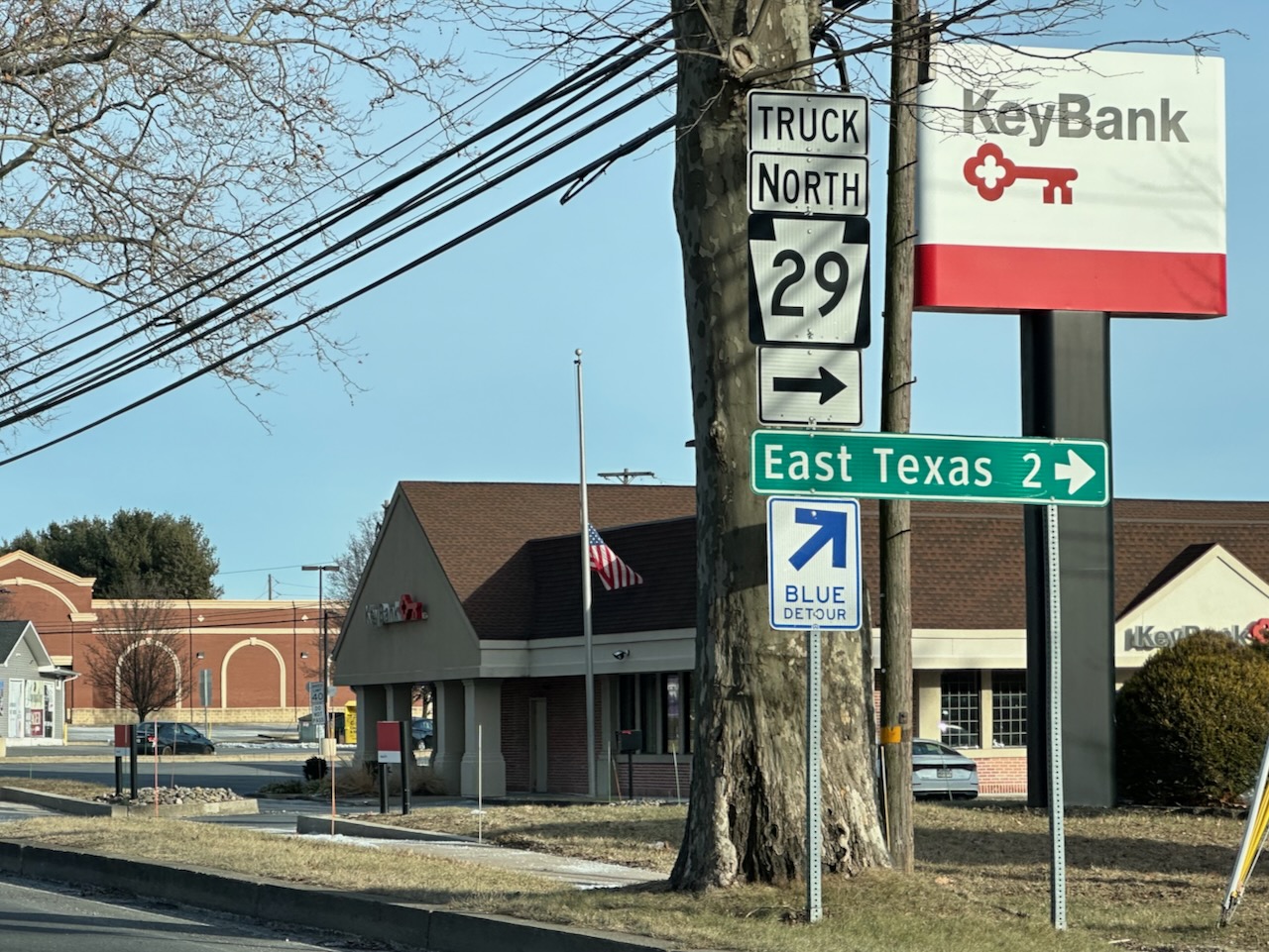 Roadside sign pointing toward East Texas. 