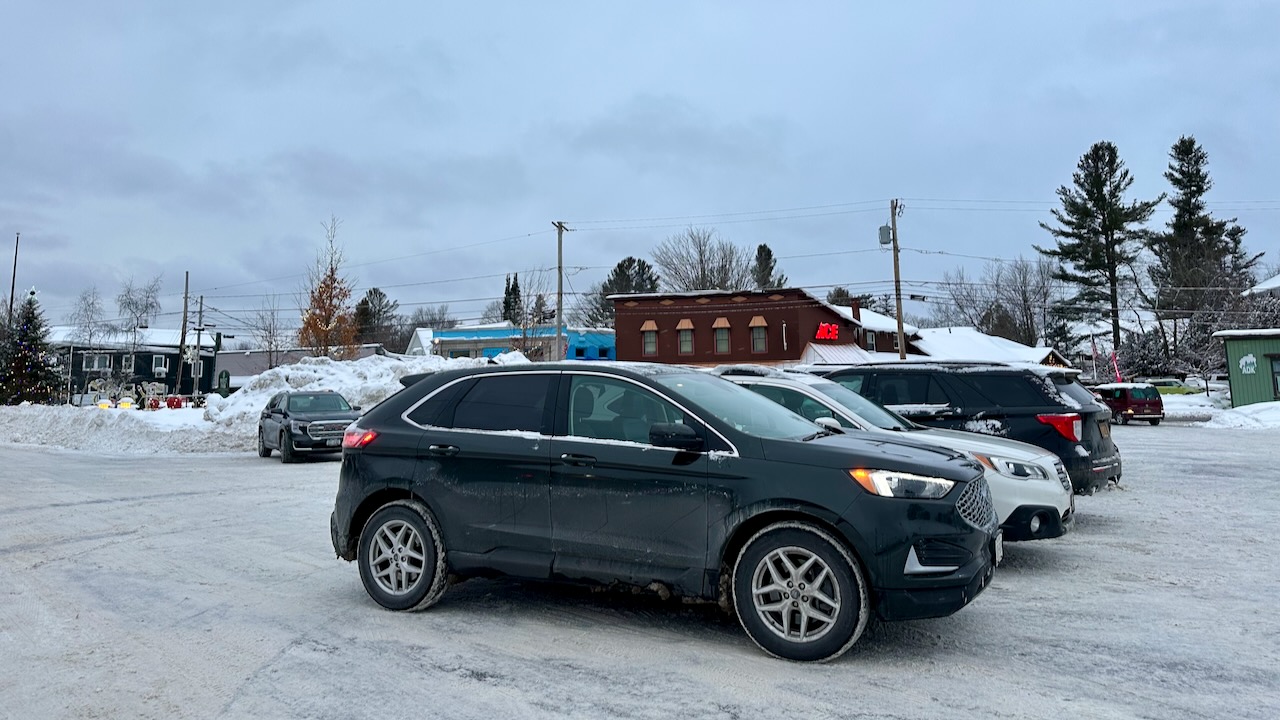 2024 Ford Edge parked on snowy parking lot. 
