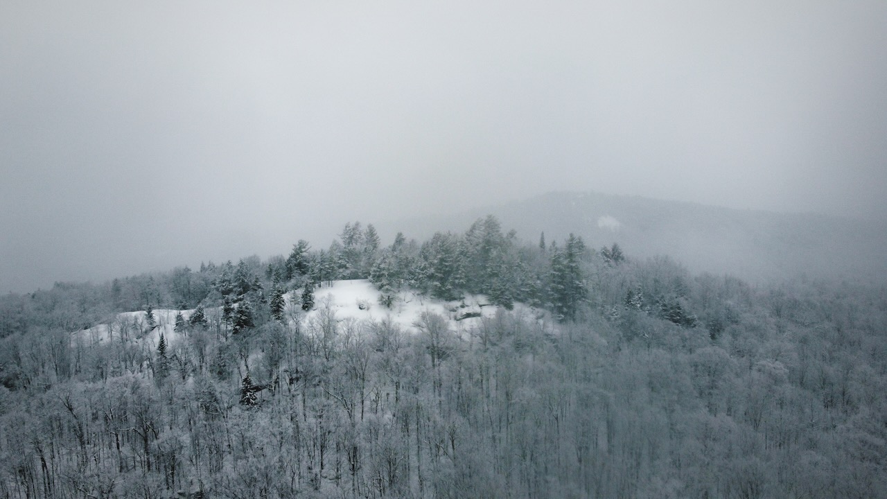 View of Eagle Cliff and surrounding countryside in snow.