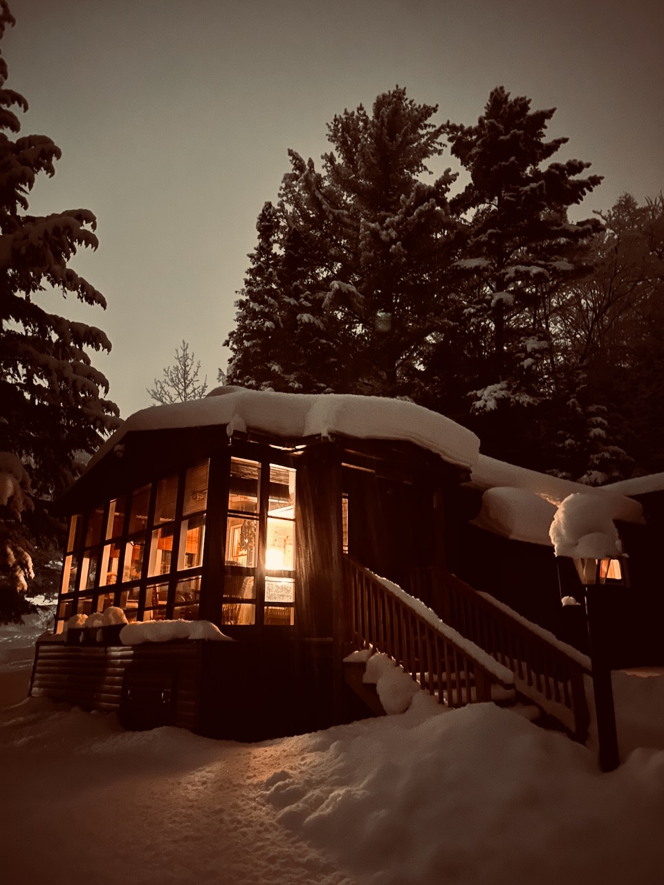 House in mountains, covered in snow. 