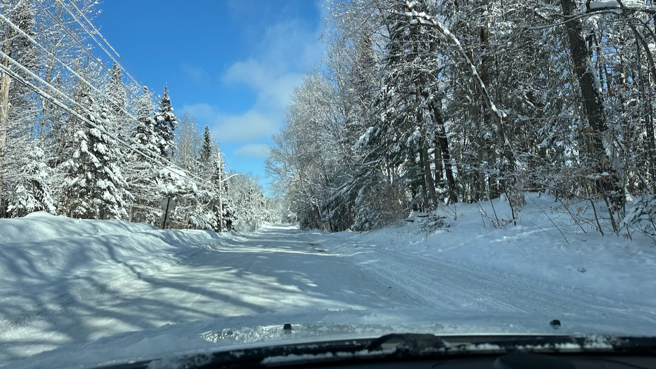 View of snow-covered road. 