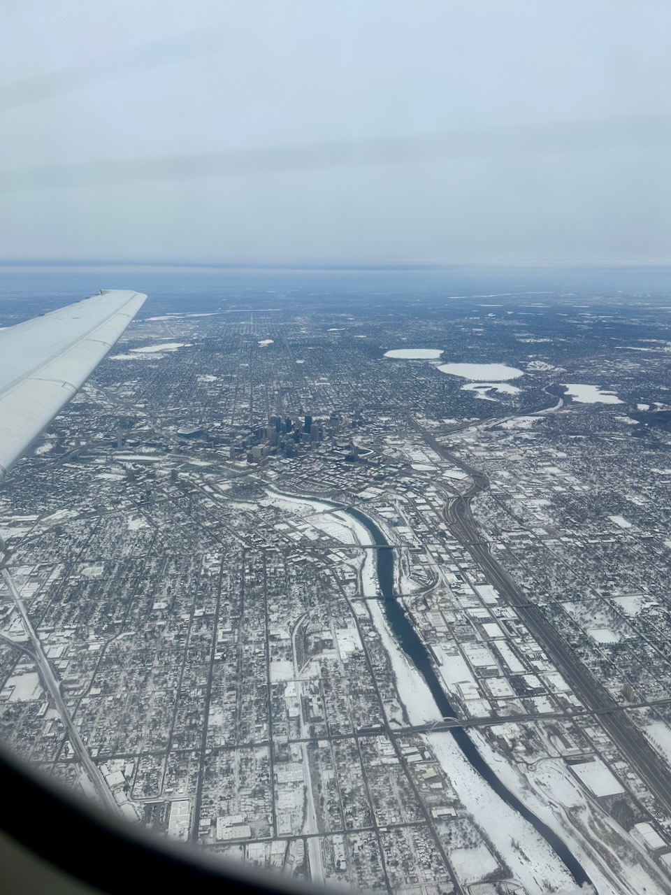 View of Minneapolis-St. Paul through airplane window. 