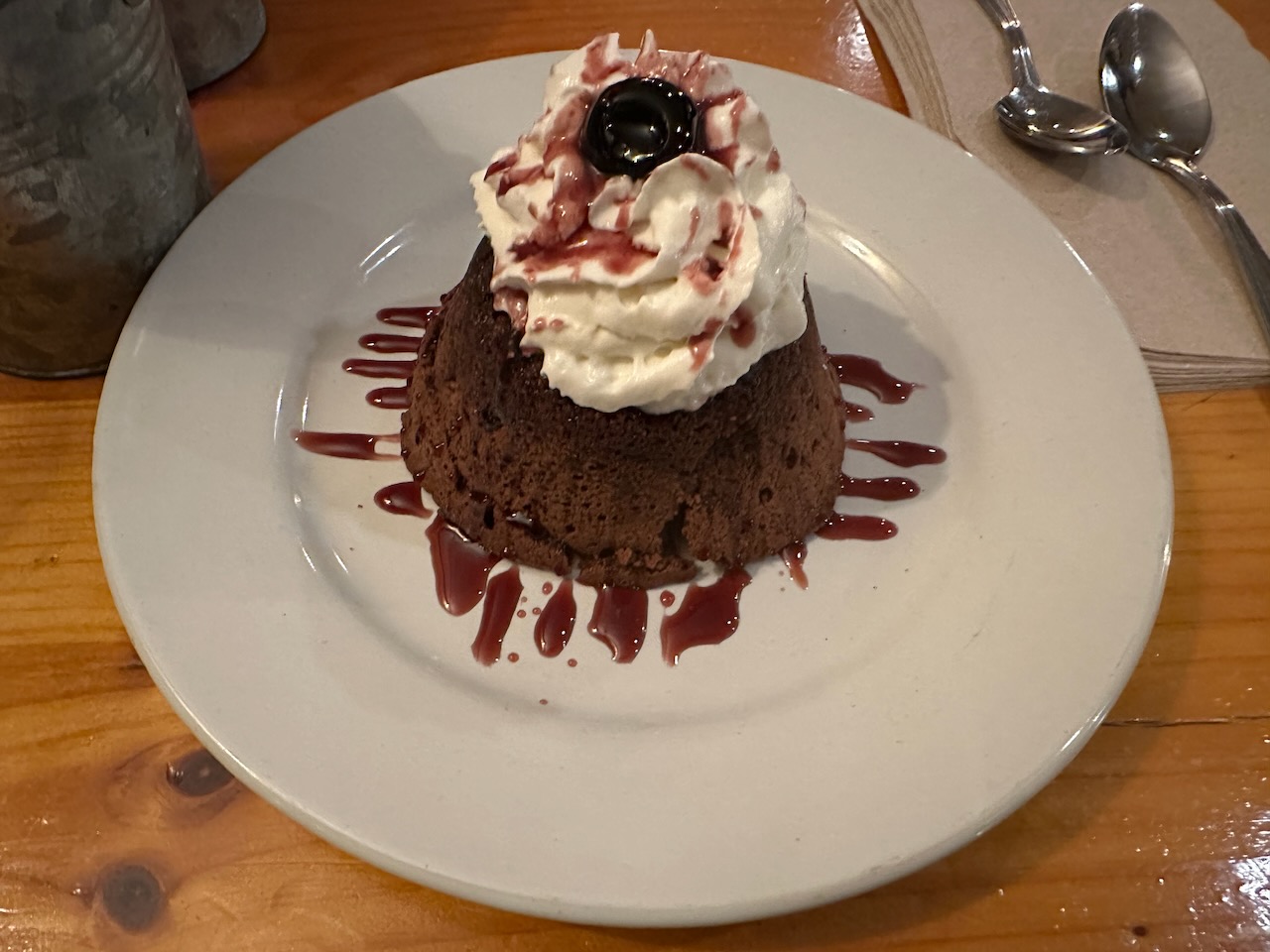 Gluten free chocolate torte with ice cream on top. 