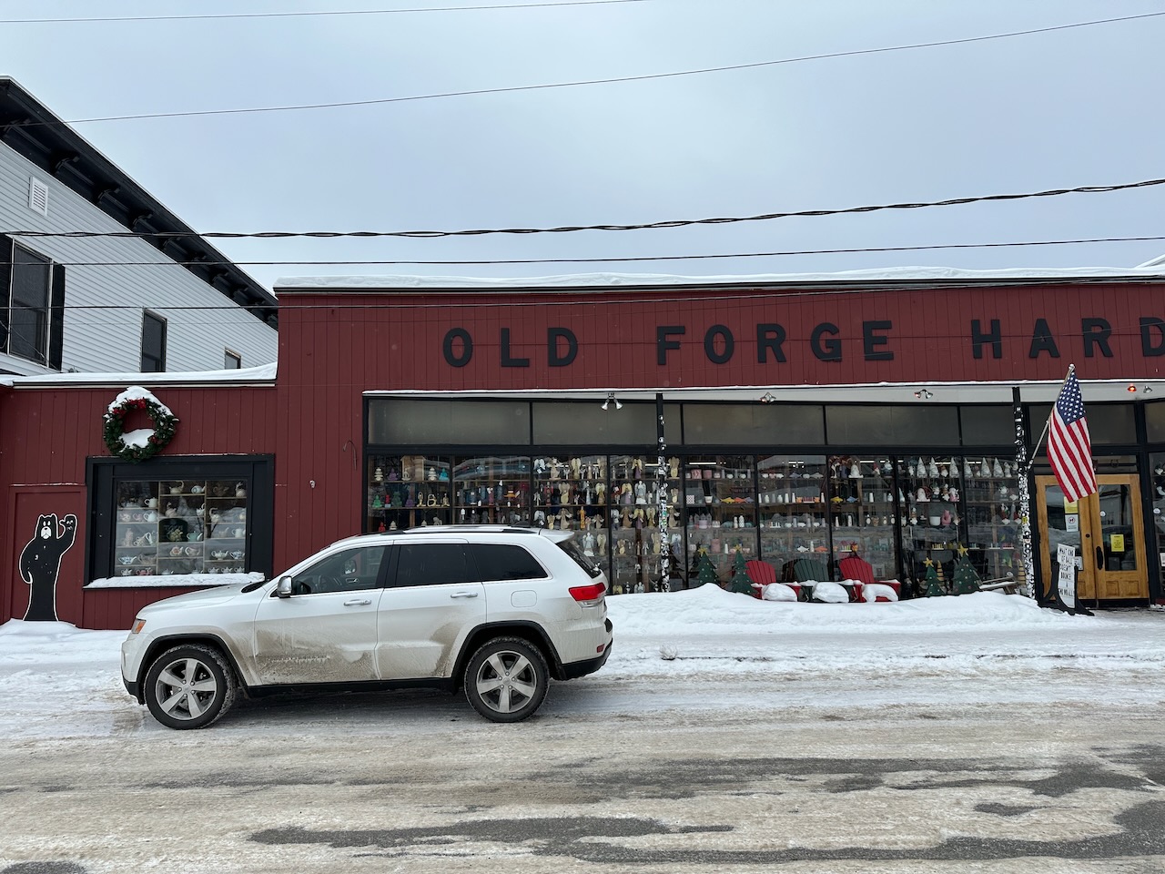 2014 Jeep Grand Cherokee parked in front of Old Forge Hardware. 