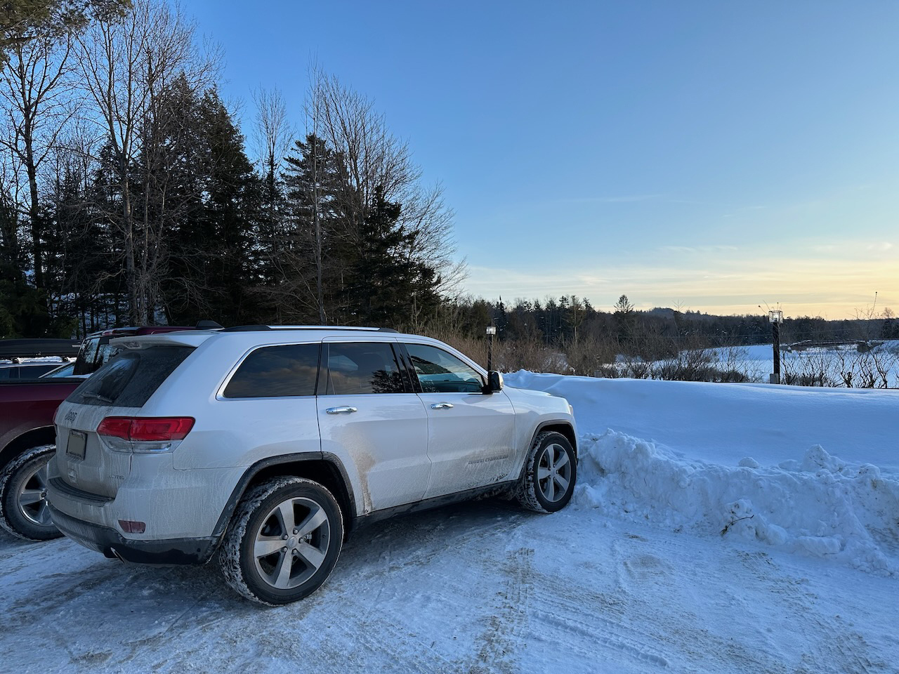 2014 Jeep Grand Cherokee parked beside Moose River. 