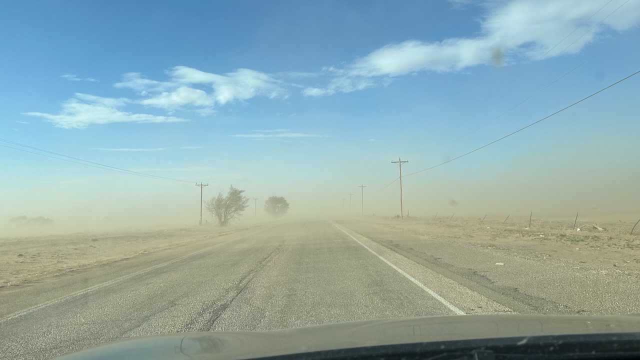 Dust storm covering road. 