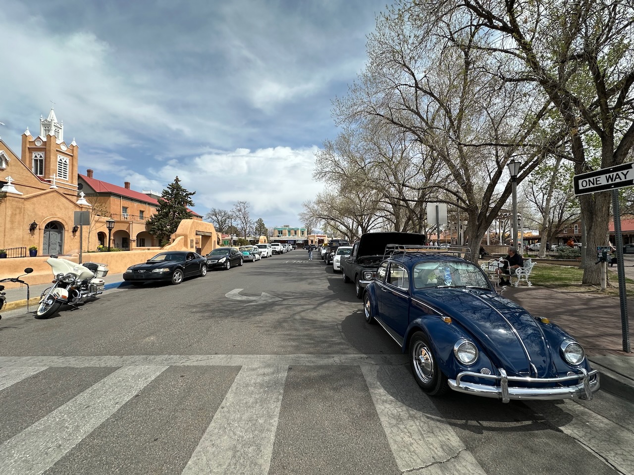 Classic Volkswagen Beetle parked on side of street in Old Town. 