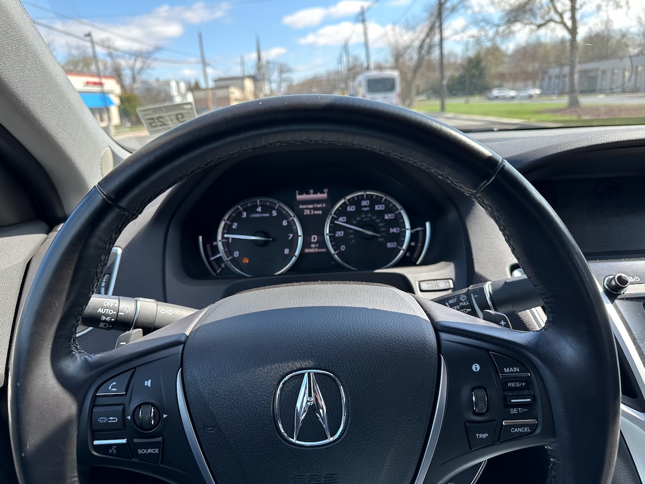 Steering wheel and gauge cluster of 2020 Acura TLX. 