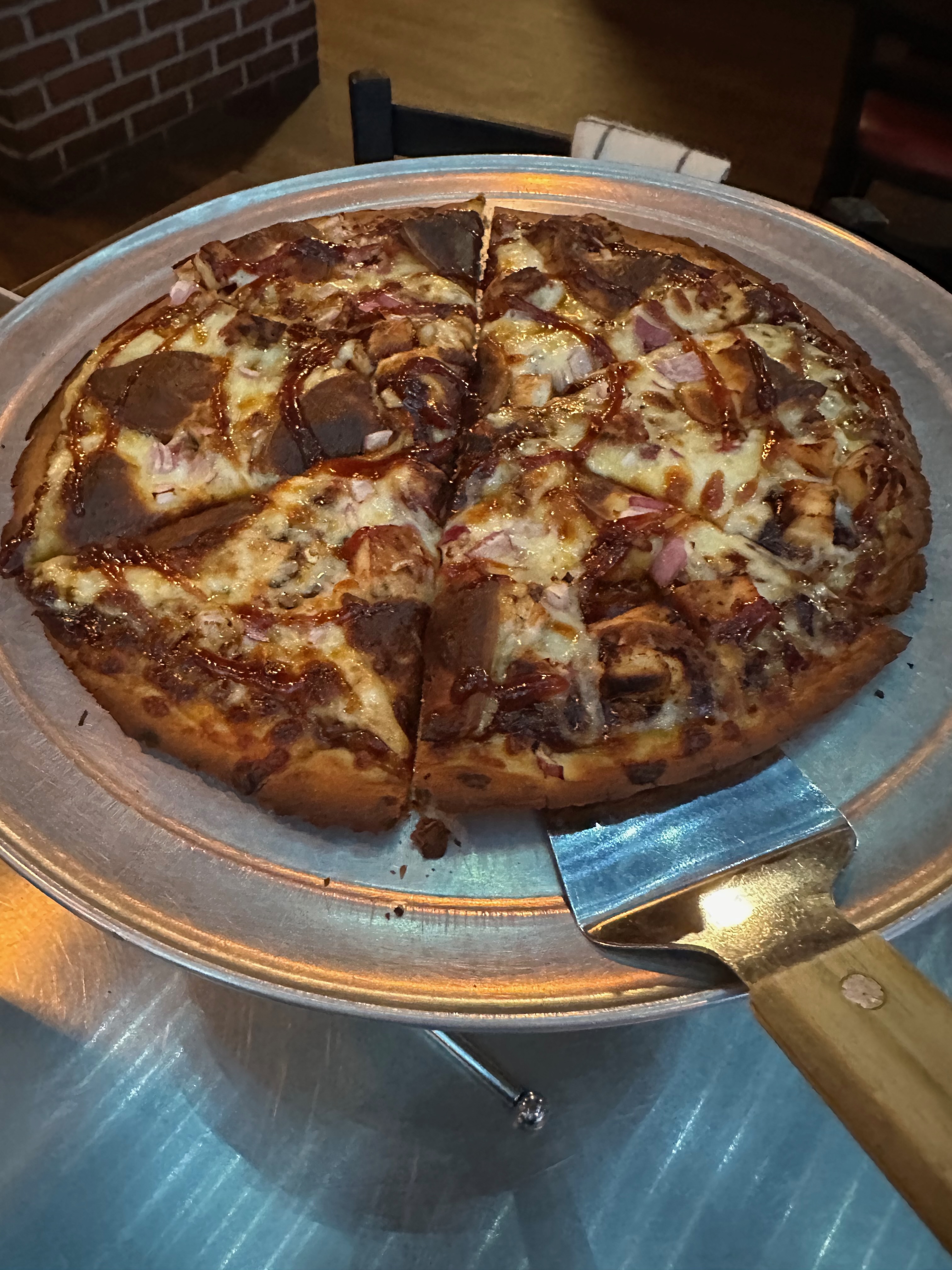 Pizza on serving platter. 