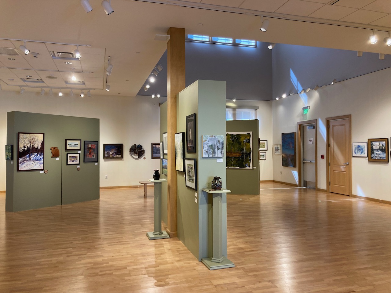 Art gallery featuring painting and photography. 