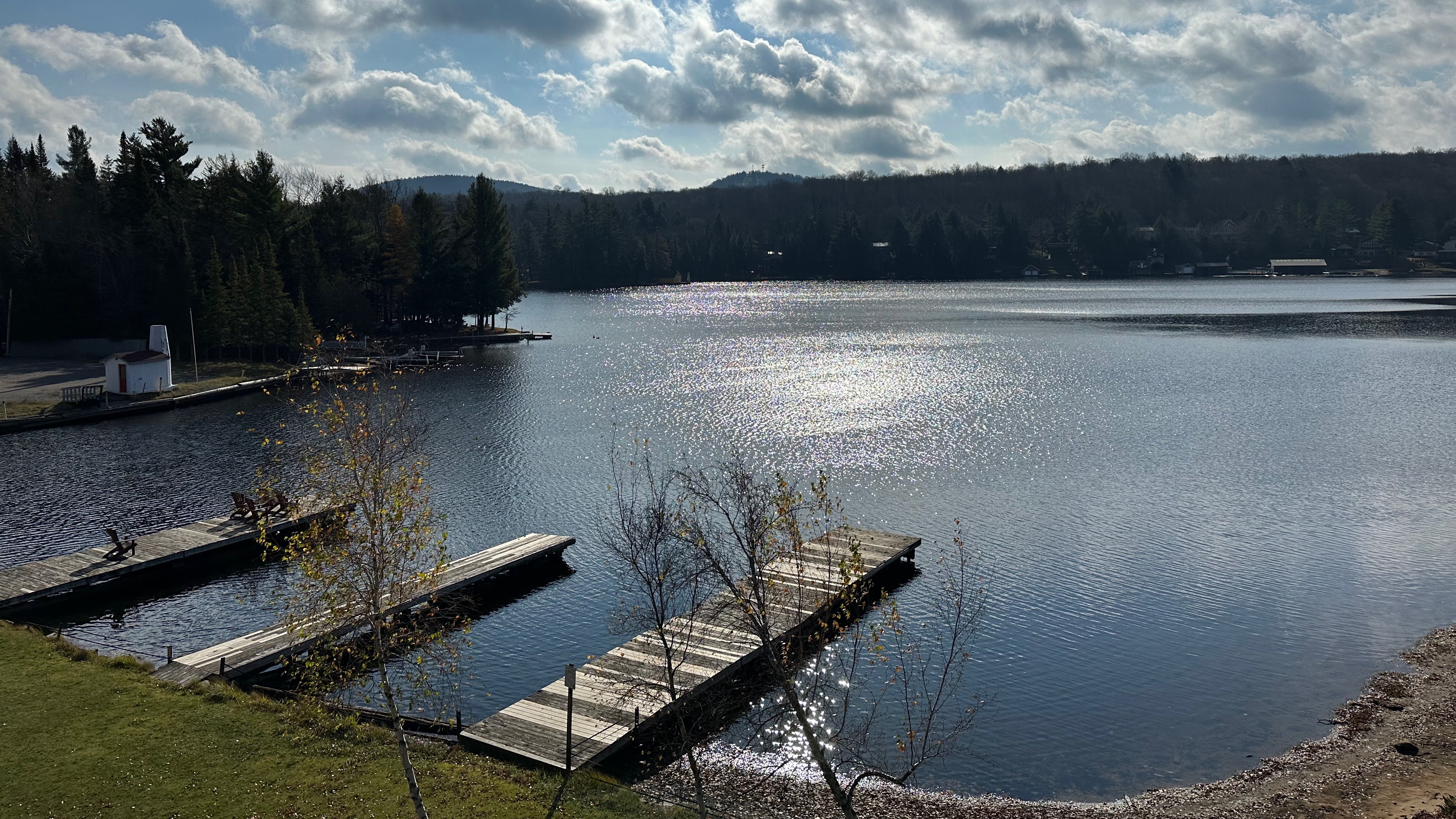 View of Old Forge Pond, with docks on side of lake. 