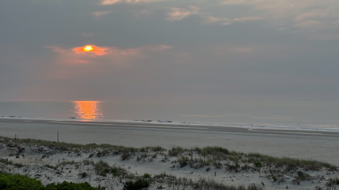 View of sunrise over ocean. 