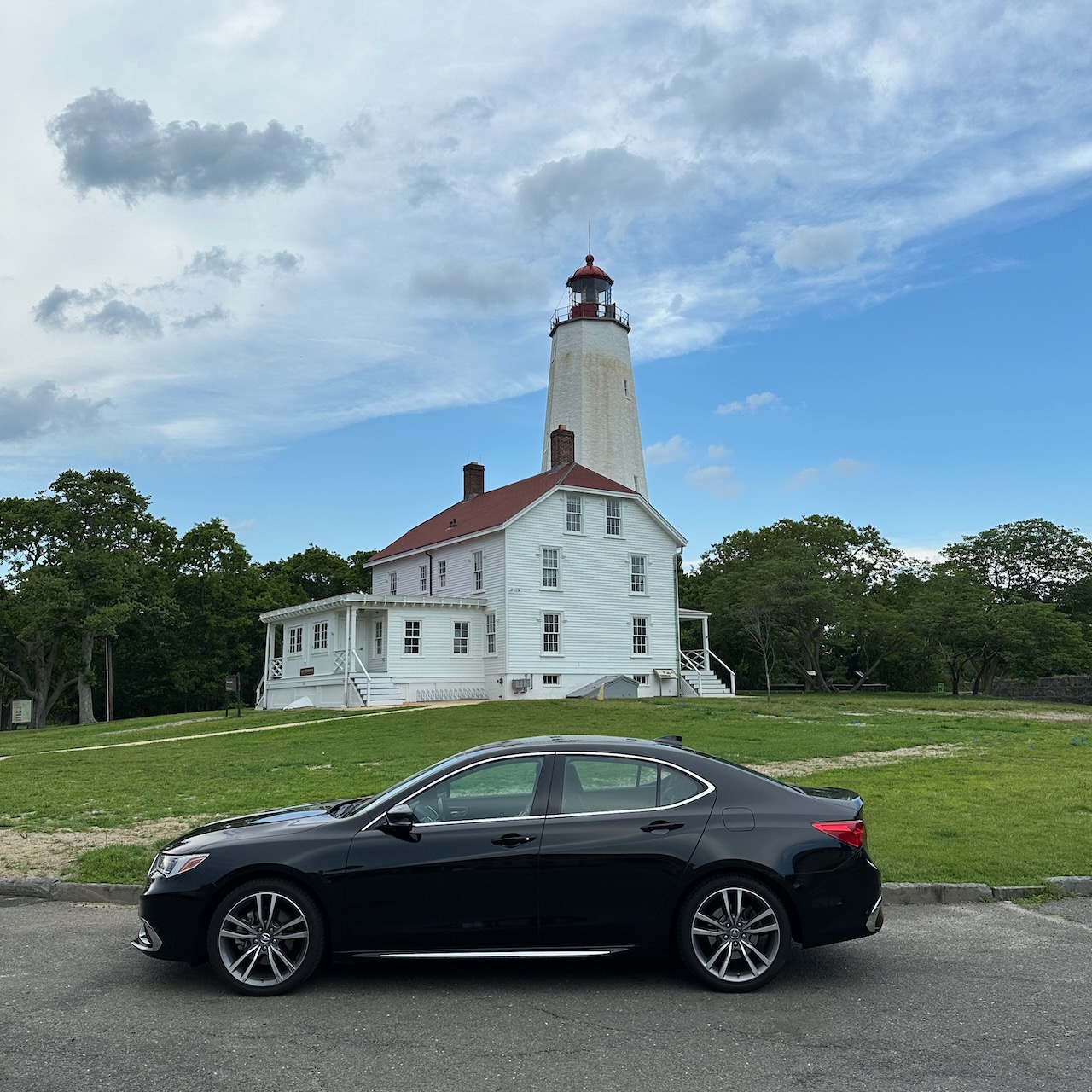 2020 Acura TLX parked in front of Sandy Hook Light. 