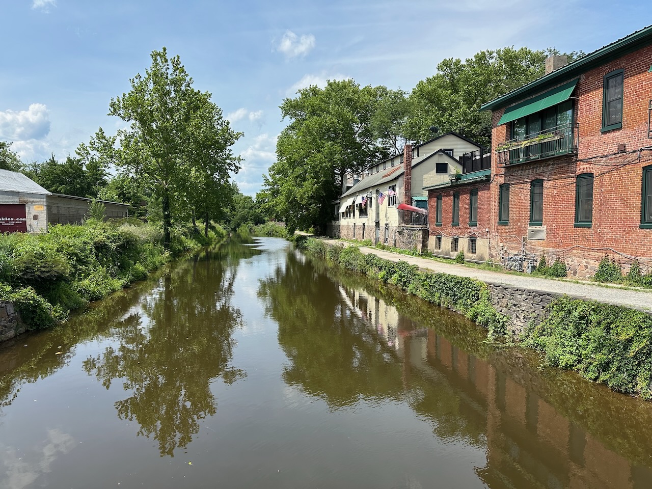 View of canal way in Lambertville, with buildings on both sides of canal. 