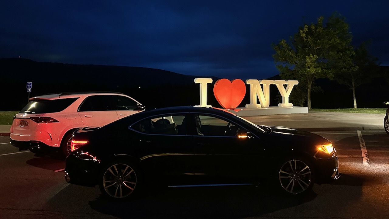 2020 Acura TLX parked in front of I LOVE NEW YORK sign. 