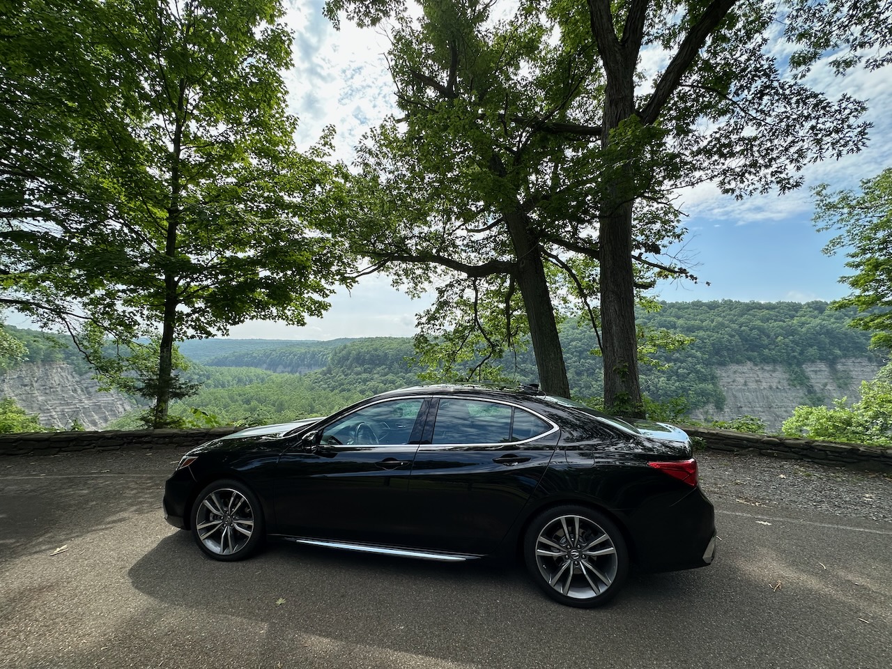 2020 Acura TLX parked in front of river gorge. 