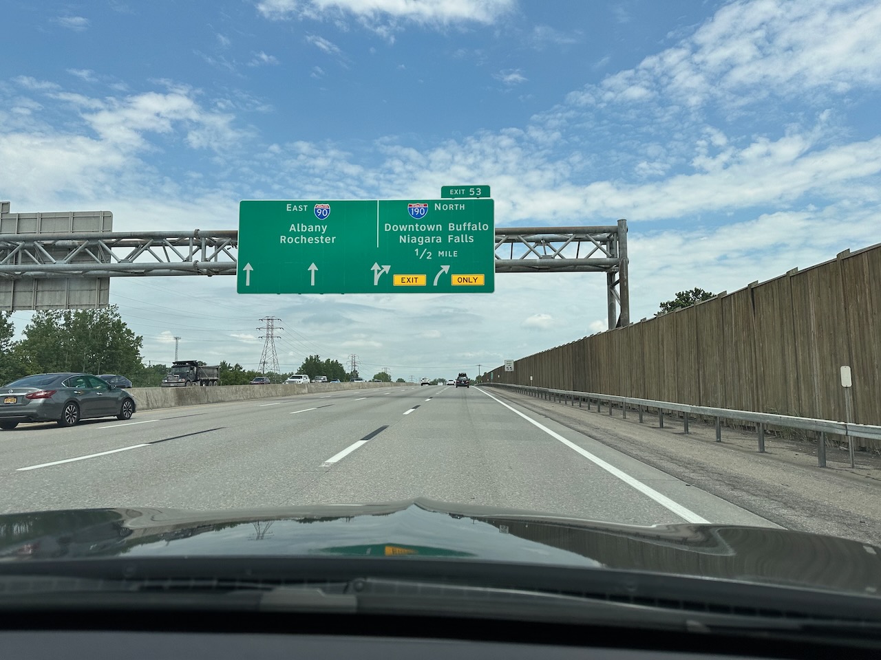 Highway with overhead signs pointing toward Downtown Buffalo and Niagara Falls - Exit 53
