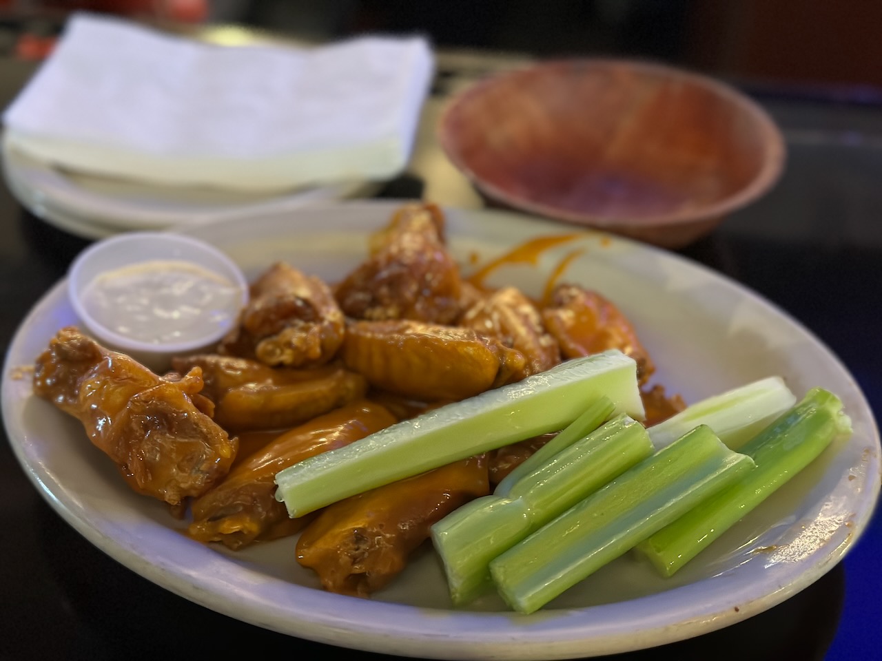 White plate with ten Buffalo wings. 