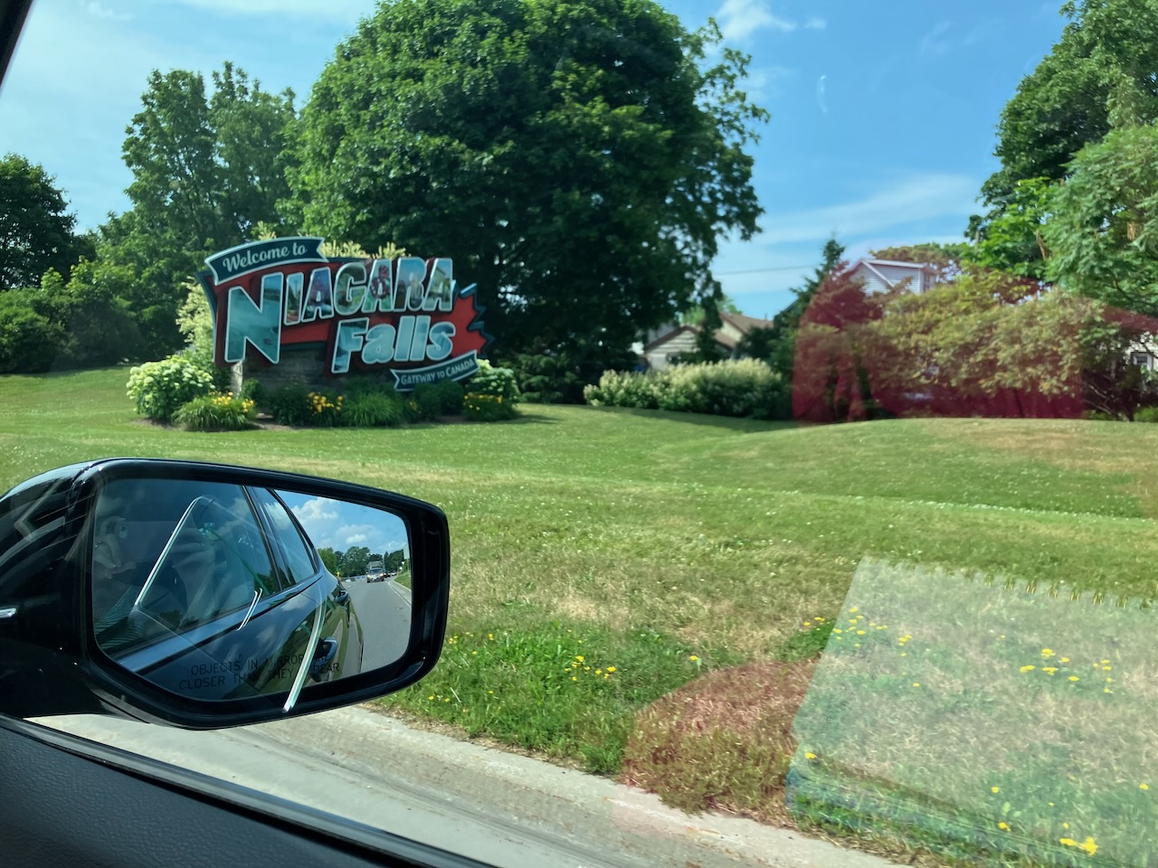 Welcome to Niagara Falls sign on side of road.