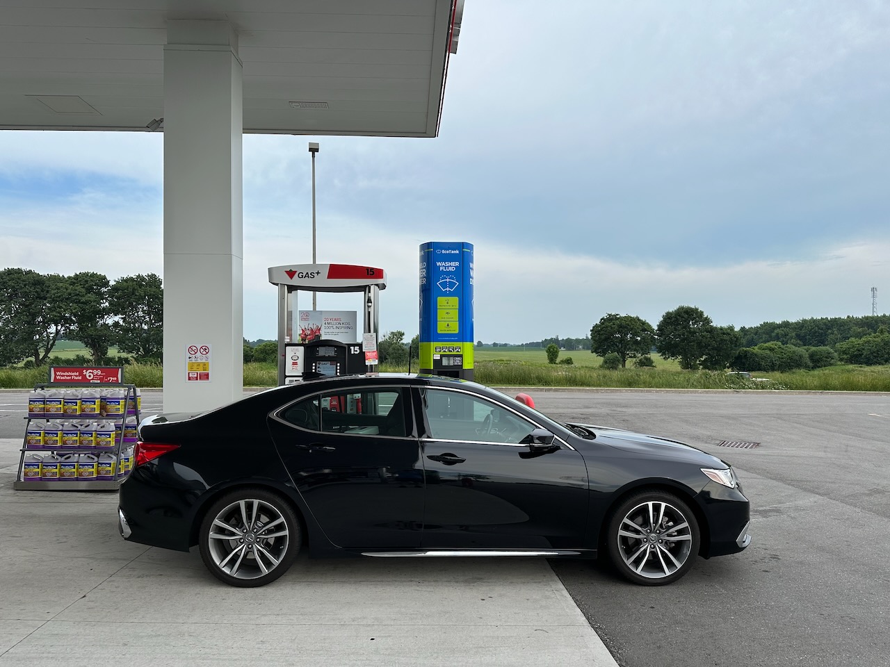 2020 Acura TLX parked in front of fuel pump.