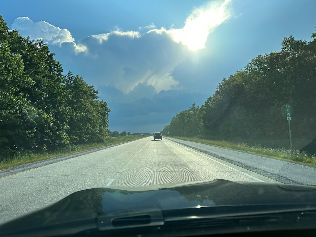 View of Ontario Highway 401 from behind dashboard of Acura TLX. 